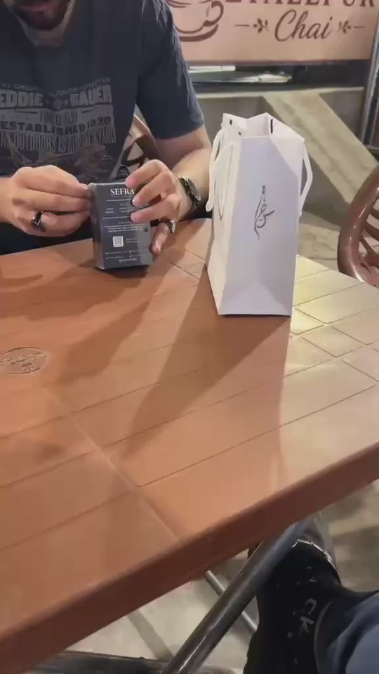 A customer opens Krave at a cafe