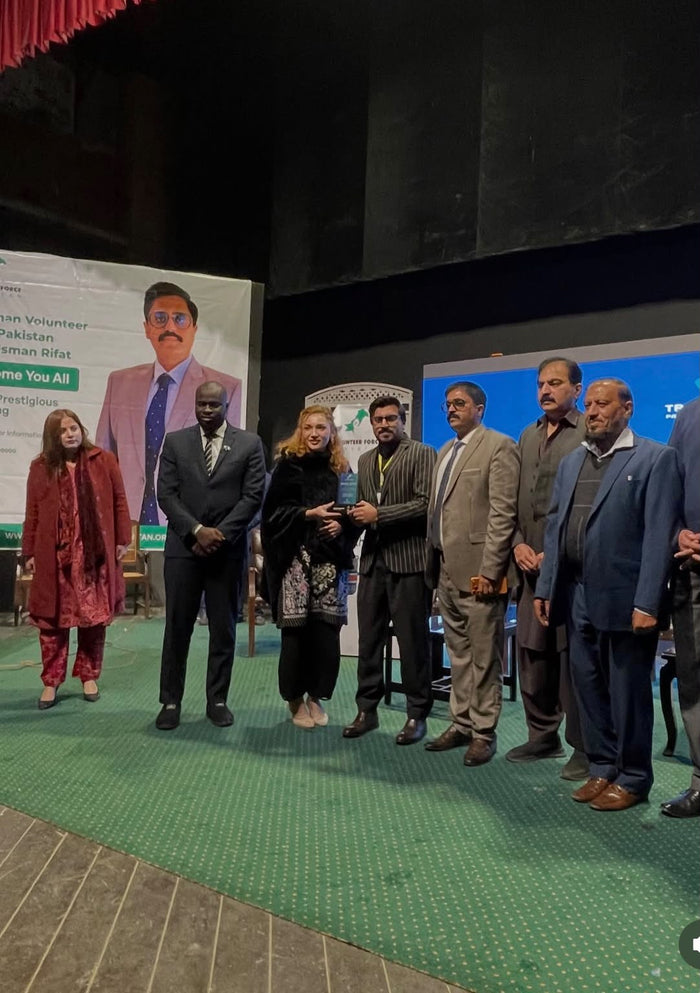 The Sefra team on stage with the award